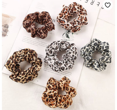 All the RAGE in Holiday Fashion: Animal Print Hair Accessories!